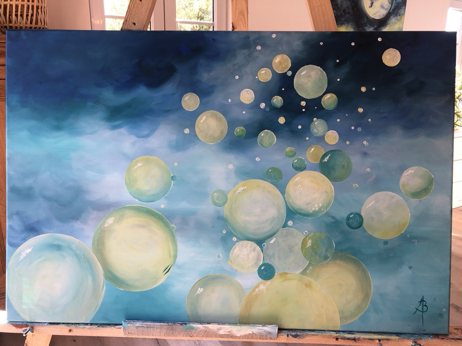 Pétillance aquatique, peinture de Béa composée de bulles jaune-vert sur un fond d’eau bleu